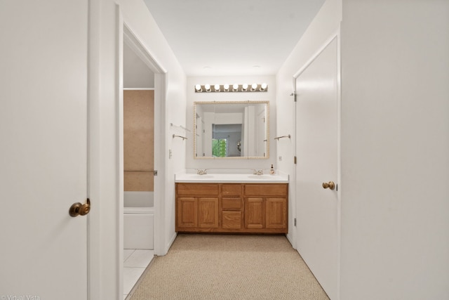 bathroom featuring vanity and a bathing tub