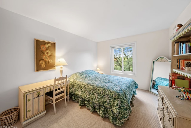 bedroom featuring light carpet