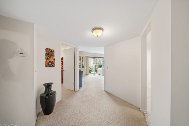 hallway with light carpet