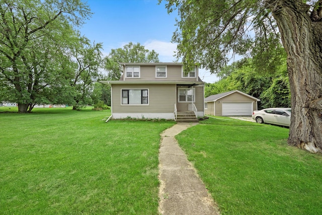 view of front of house with a garage, a front lawn, and an outdoor structure