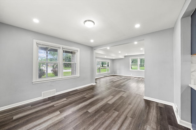 unfurnished living room with wood-type flooring