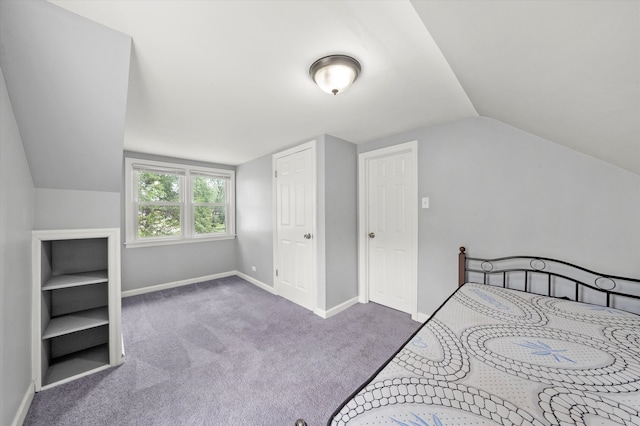 bedroom featuring carpet flooring and lofted ceiling