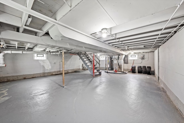 basement featuring a healthy amount of sunlight and electric panel