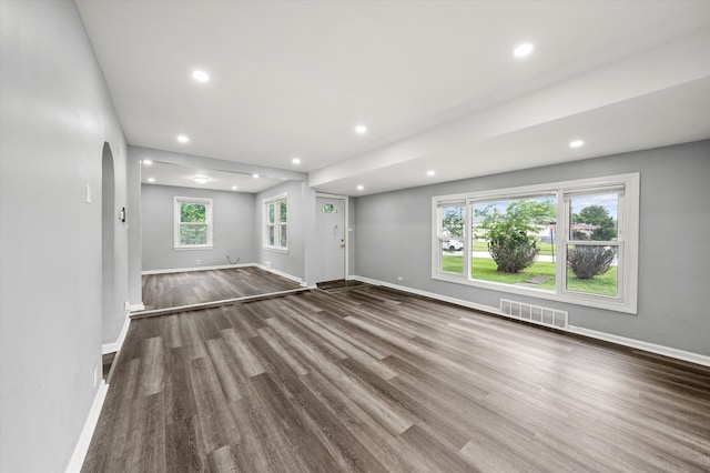 unfurnished living room featuring wood-type flooring