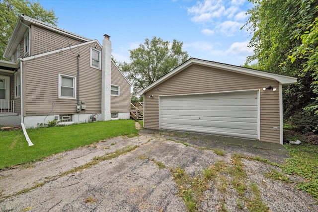 garage featuring a lawn