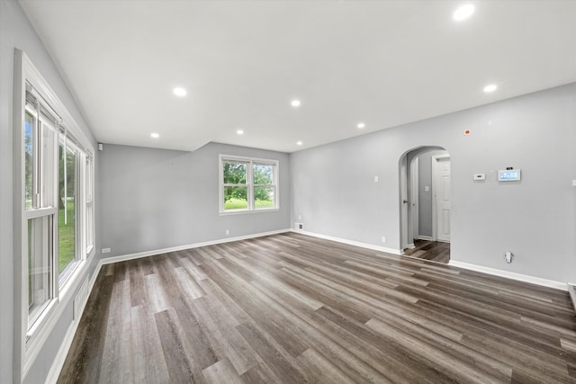 unfurnished living room with hardwood / wood-style flooring