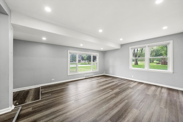 unfurnished living room with hardwood / wood-style floors