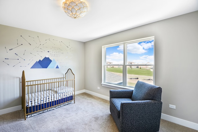 bedroom with carpet flooring and a crib