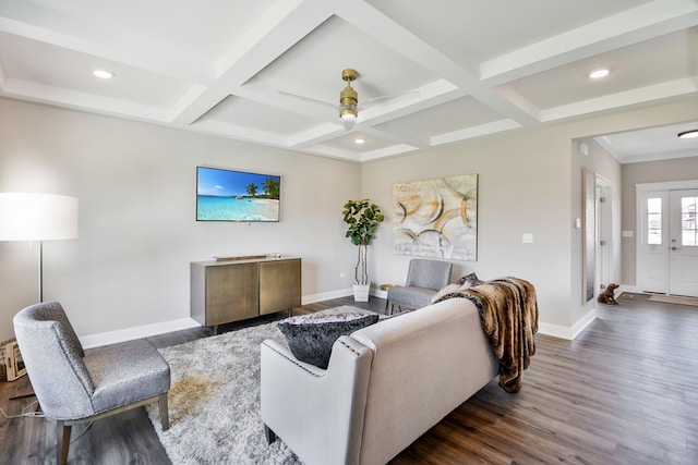 living room featuring beam ceiling, dark hardwood / wood-style flooring, coffered ceiling, and ceiling fan