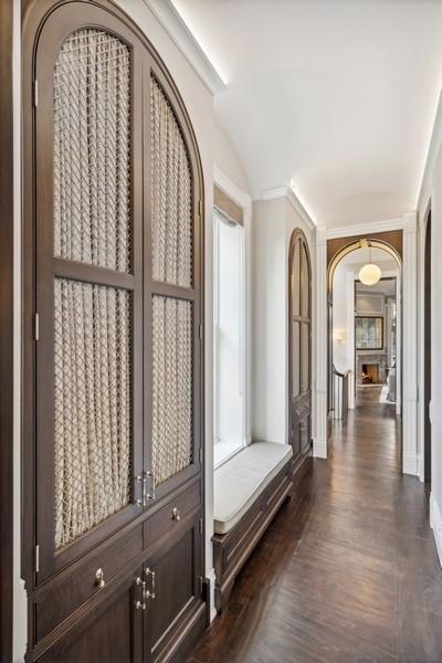 1407 N Hoyne Ave, Chicago, IL 60622 - hallway featuring arched walkways, dark wood-style floors, and lofted ceiling