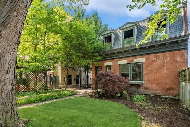1407 N Hoyne Ave, Chicago, IL 60622 - rear view of property featuring mansard roof, brick siding, and a high end roof
