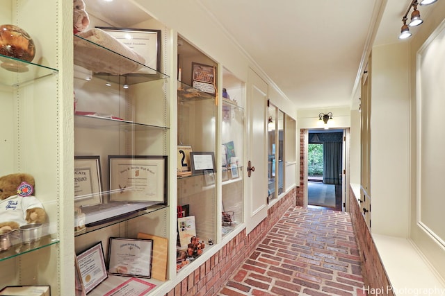 hall with crown molding and hardwood / wood-style floors