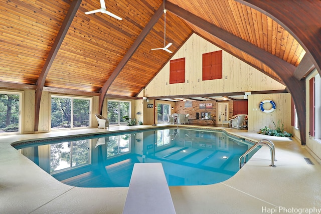 view of pool with a diving board