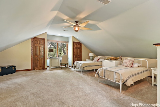 carpeted bedroom featuring ceiling fan and lofted ceiling