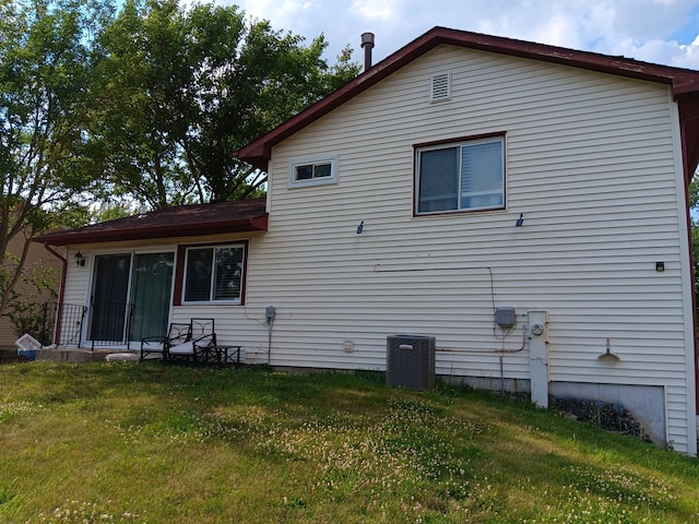 view of home's exterior with a yard