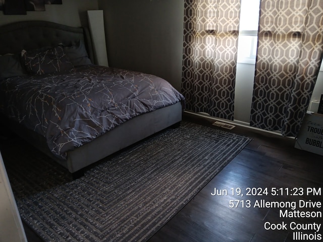 bedroom featuring hardwood / wood-style flooring