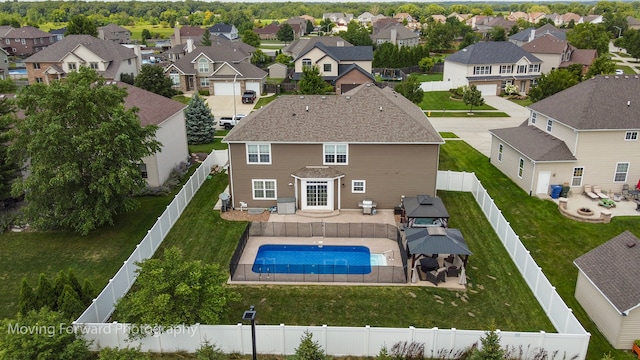 view of swimming pool featuring a patio area and a yard