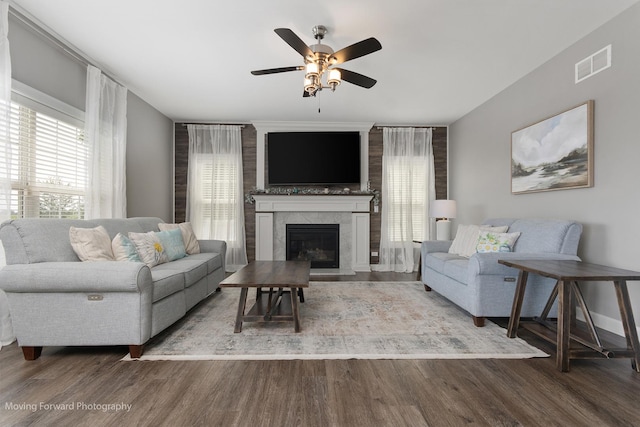 living room featuring hardwood / wood-style floors, a fireplace, and ceiling fan