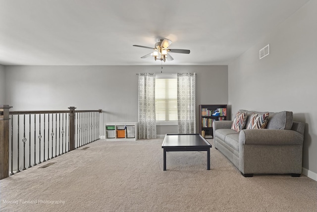 carpeted living room featuring ceiling fan