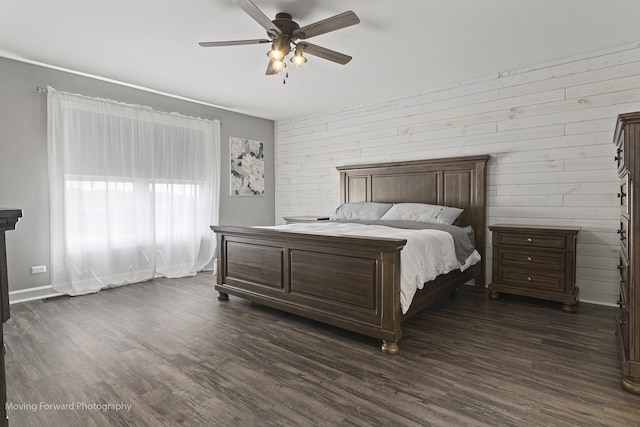 bedroom featuring ceiling fan and dark hardwood / wood-style floors