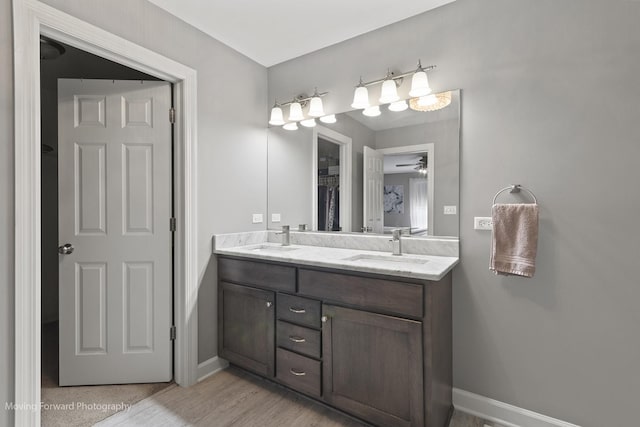 bathroom featuring hardwood / wood-style flooring and vanity