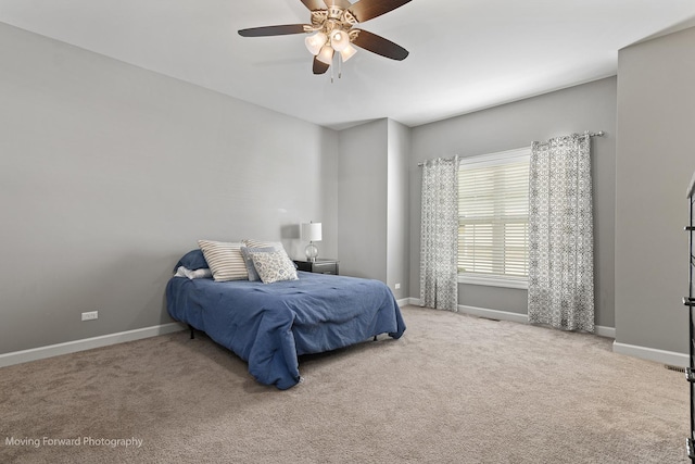 carpeted bedroom featuring ceiling fan