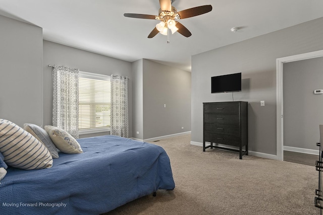 carpeted bedroom with ceiling fan