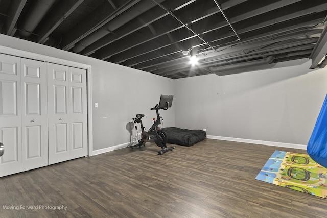 exercise area with dark hardwood / wood-style floors