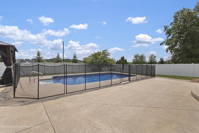 view of swimming pool featuring a patio