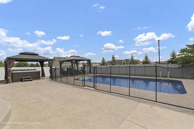 view of swimming pool with a gazebo, a hot tub, and a patio