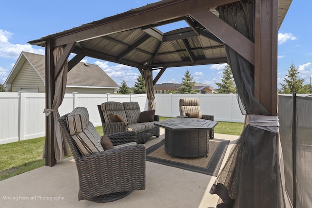 view of patio featuring a fire pit and a gazebo