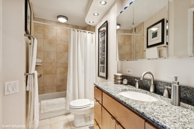 full bathroom with shower / tub combo with curtain, toilet, tile patterned flooring, and vanity