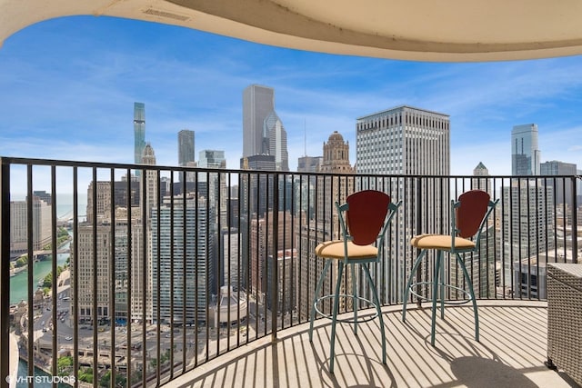 balcony featuring a water view