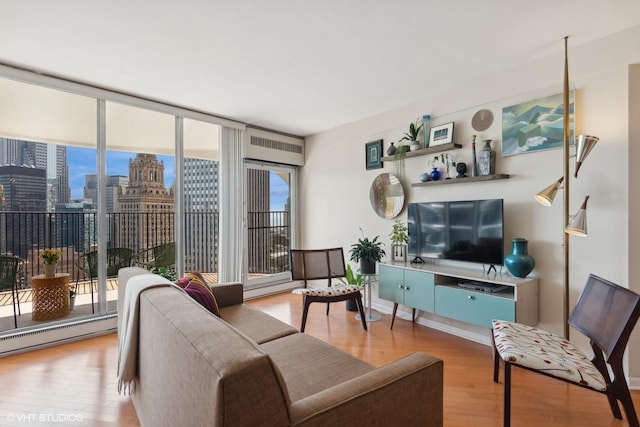 living room with hardwood / wood-style flooring and baseboard heating