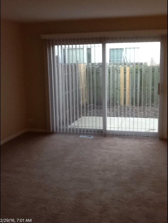 empty room featuring carpet floors