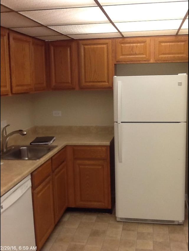 kitchen with sink and white appliances