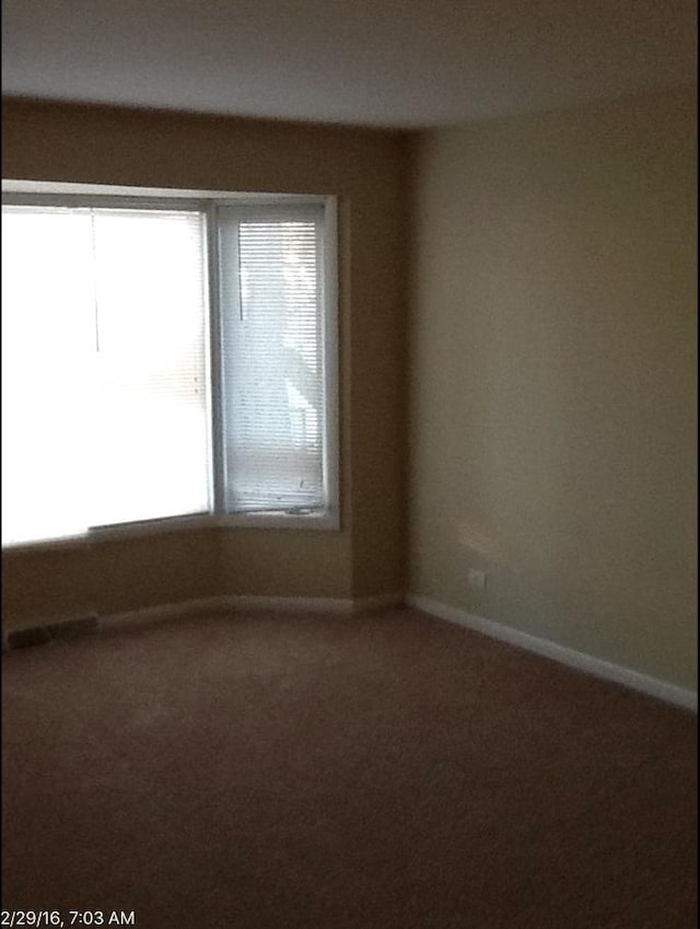 view of carpeted spare room