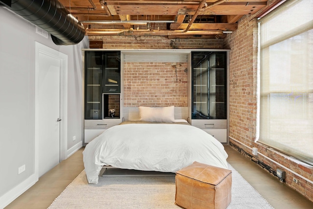 bedroom with brick wall