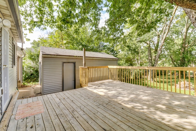 wooden deck with a storage shed