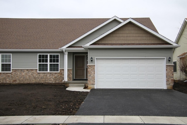 craftsman house with a garage