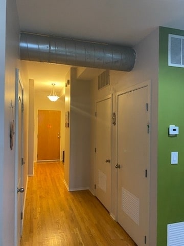 hallway featuring light hardwood / wood-style floors