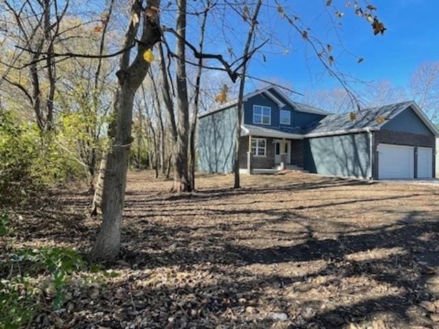 460 N School St, Braidwood, IL 60408 - view of front of house featuring a garage