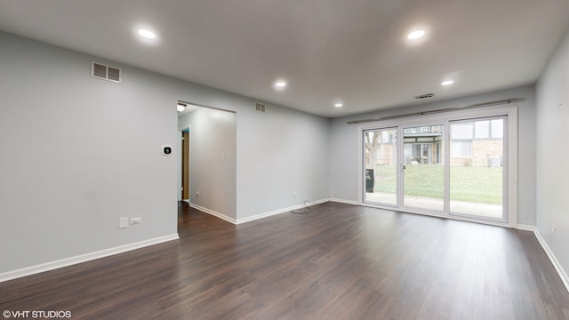 unfurnished room featuring dark wood-type flooring