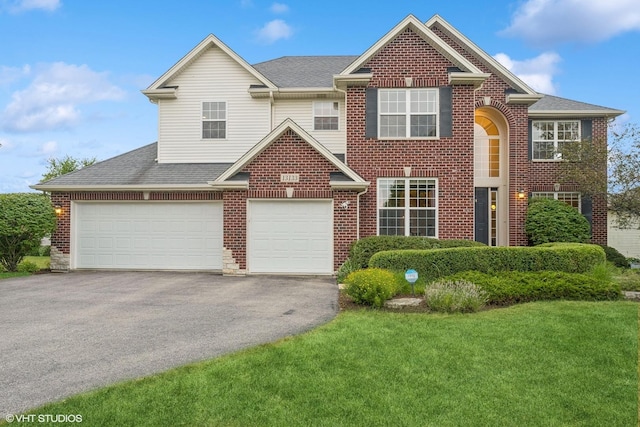 view of front of house with brick siding, a shingled roof, a front lawn, aphalt driveway, and an attached garage