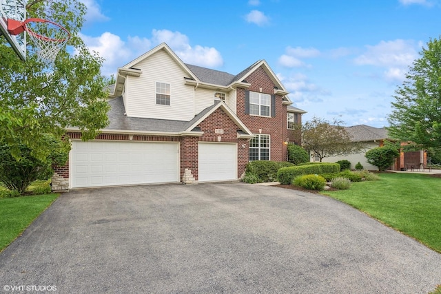 view of front of home featuring a front yard, an attached garage, a shingled roof, aphalt driveway, and brick siding