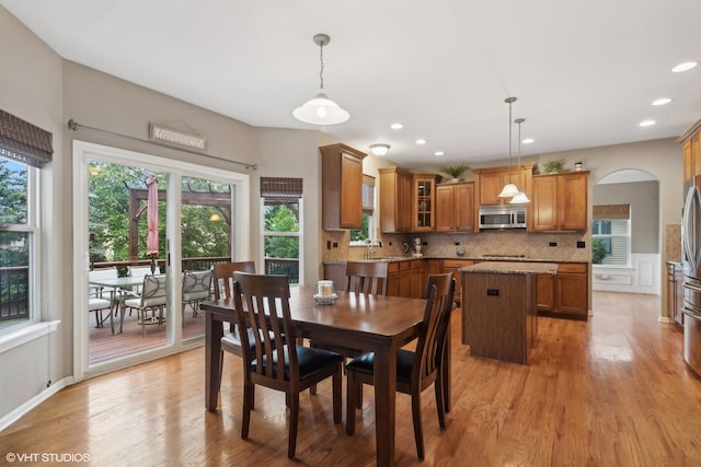 dining area featuring recessed lighting and light wood-type flooring