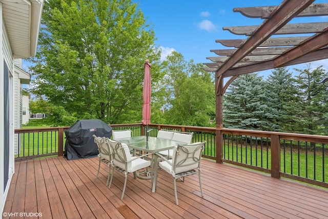 wooden terrace with area for grilling, a pergola, outdoor dining area, and a yard