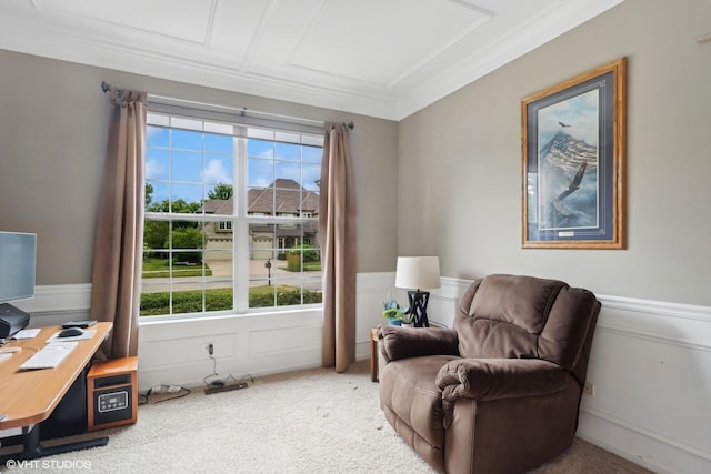 sitting room with a decorative wall, ornamental molding, carpet, and wainscoting