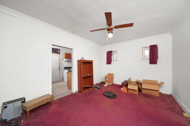 miscellaneous room with a ceiling fan, ornamental molding, and carpet flooring