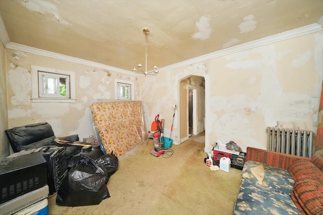 interior space with ornamental molding, arched walkways, radiator, and carpet